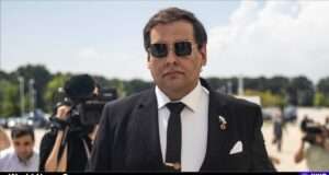 Explore the rise and fall of George Santos, highlighting accountability and integrity in politics (static01.nyt.com).